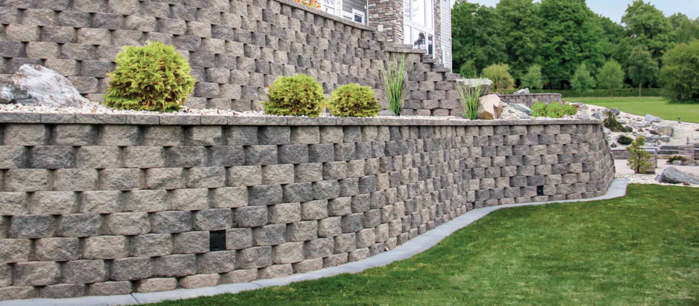 Segmental block retaining wall with a planted terrace above it